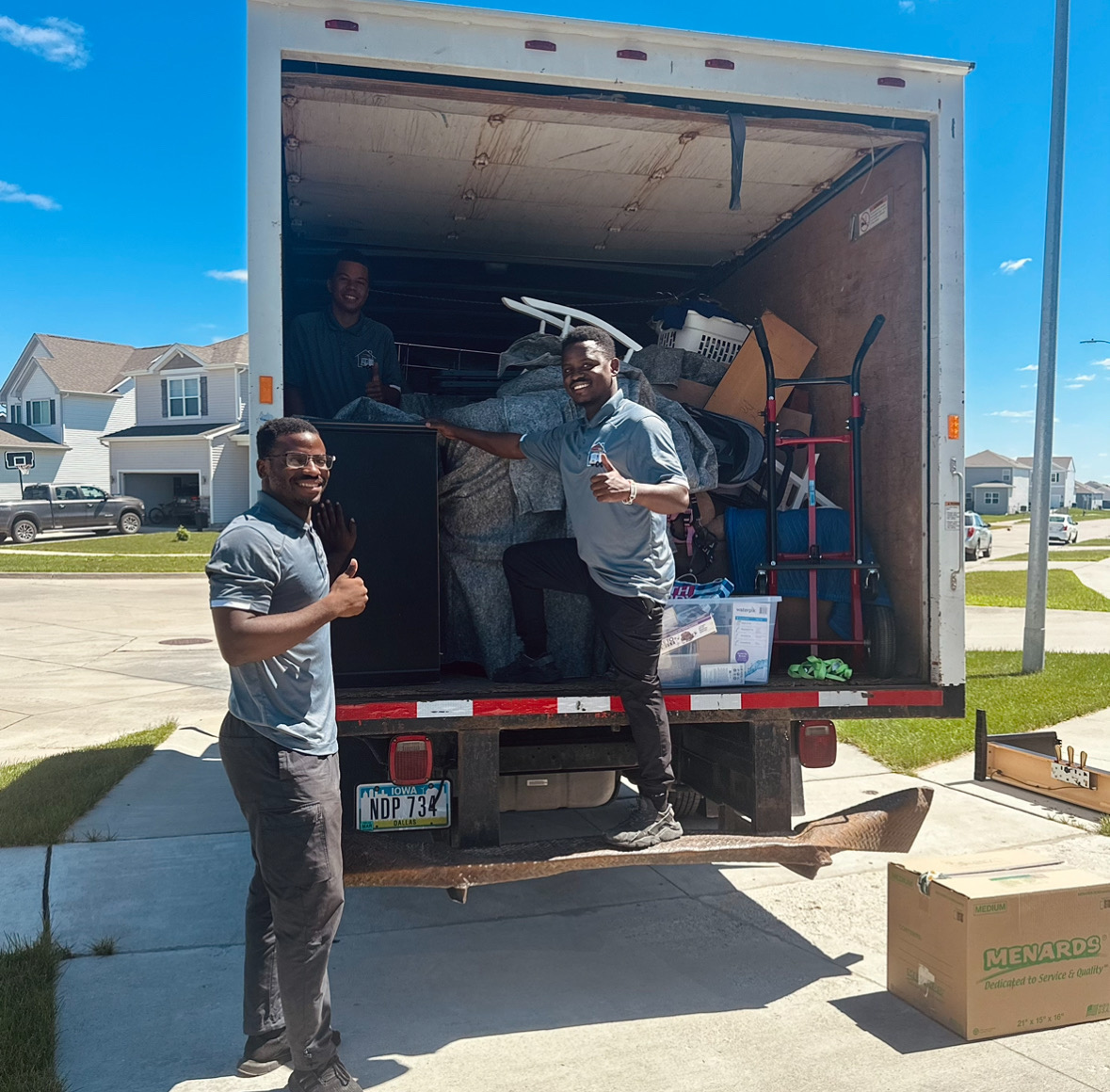 Midwest Moving Pros crew loading a moving truck at a Boone Iowa home.